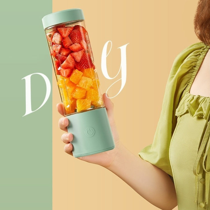 Portable USB rechargeable juicer, blending fruits into a smoothie.