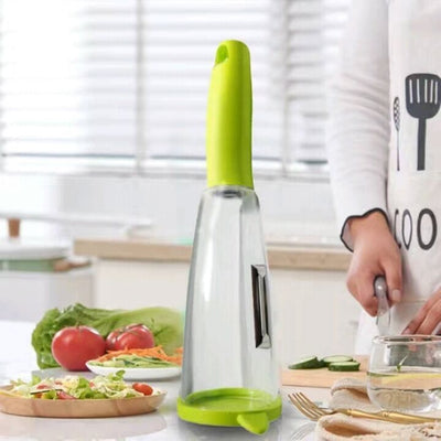 Image of the Multifunctional Storage Box Peeler with various peeled vegetables surrounding it