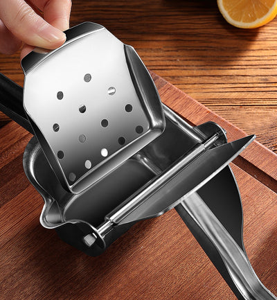 Close-up of the porous filter and juice outlet of the Stainless Steel Manual Juice Squeezer.