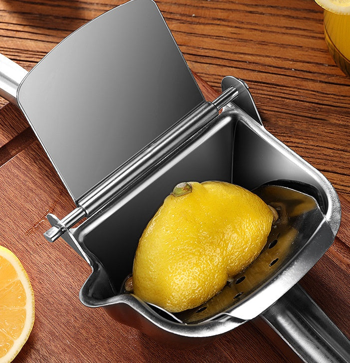 The 304 Stainless Steel Manual Juice Squeezer laying on a kitchen counter top